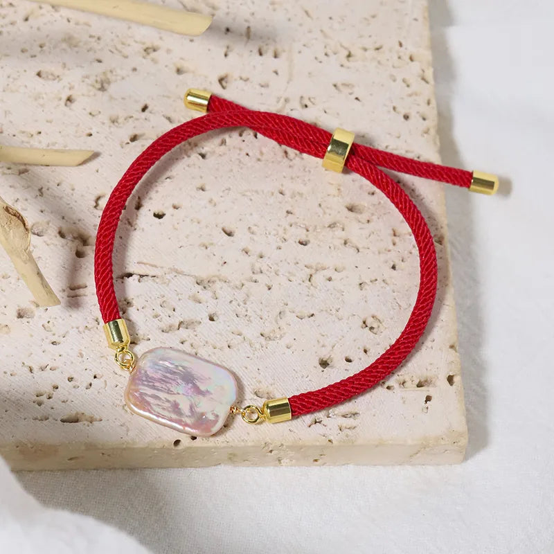 Bracelet cordon rouge perle nacrée acier inoxydable - vue de face
