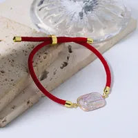 Bracelet cordon rouge perle nacrée acier inoxydable - détail perle
